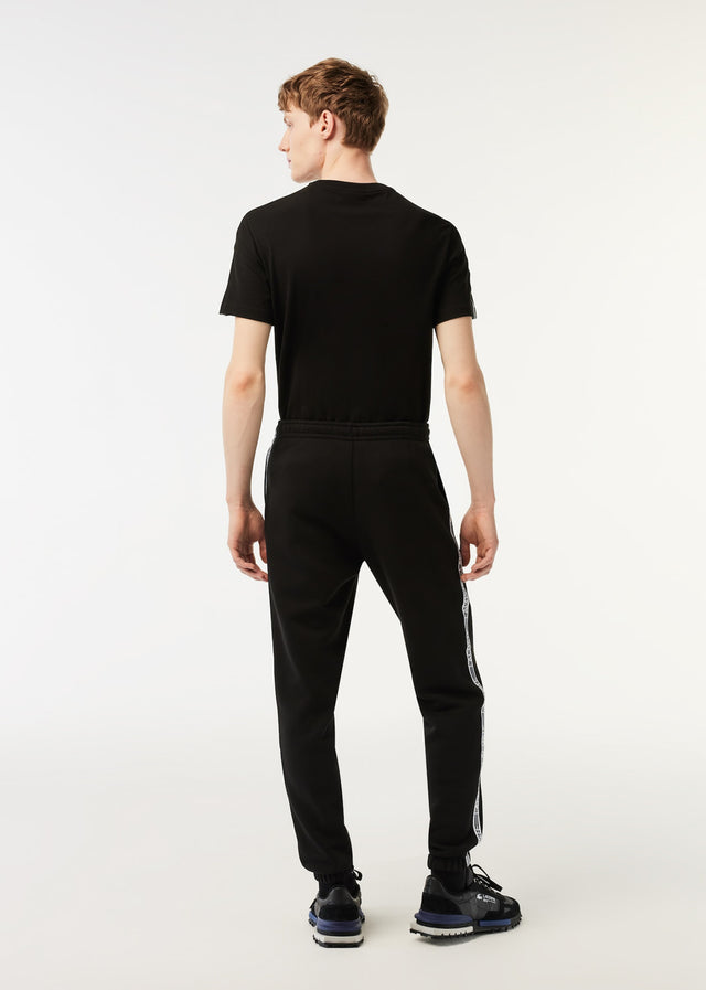 Lacoste Pants  Contrast stripe tracksuit trousers - black 