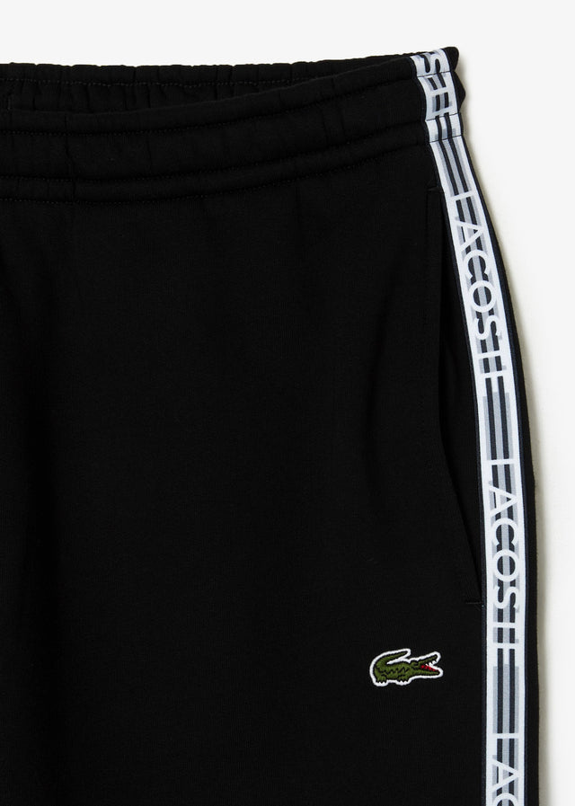 Lacoste Pants  Contrast stripe tracksuit trousers - black 