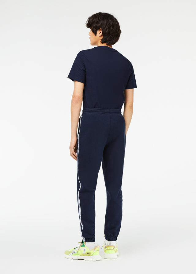 Lacoste Pants  Contrast stripe tracksuit trousers - navy blue 